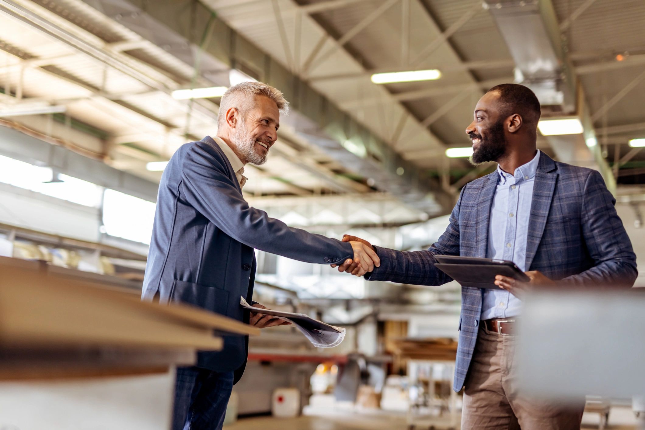 executive handshake partnership home furnishings industry